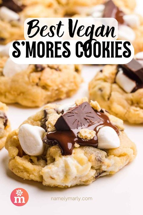 Get ready to indulge in the ultimate treat! Our vegan s'mores cookies are a heavenly combination of gooey marshmallows, rich chocolate, and buttery graham crackers, all baked to perfection in a soft and chewy cookie. These mouthwatering treats are perfect for satisfying your sweet tooth, and are sure to be a hit with family and friends. So why wait? Try our smores cookies today and treat yourself to a little bit of heaven! Vegan S’mores Cookies, Vegan Smores Cookies, Smore Cookies, Vegetarian Marshmallows, Vegan Smores, Vegan Chocolate Bars, S Mores Cookies, Stuffed Cookies, Smores Cookies