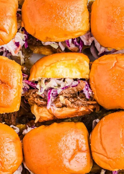 Make the ultimate BBQ pulled pork sliders with this easy pulled pork slider recipe! Tender pulled pork, topped with tangy coleslaw, all served on soft Hawaiian rolls, makes these sliders perfect for game days or parties. Whether you're using the slow cooker or Instant Pot, these pulled pork sliders come together effortlessly and will be a hit with any crowd. Slow Cooker Pulled Pork Sliders, Pulled Pork Barbeque Recipes, Slaw For Pork Sliders, Bbq Hawaiian Roll Sliders, Pork Loin Sliders Hawaiian Rolls, Pulled Pork Sliders For A Crowd, Pulled Pork Hawaiian Rolls Sliders, Bbq Sliders Recipes Hawaiian Rolls, Pork Sliders Hawaiian Rolls