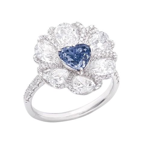 Center Stone: Gia certified natural 1.00ct + Fancy Gray-Blue Matching: 6 white diamonds totaling about 2.48 carats, 77 white diamonds totaling about 0.50 carats, 18K The Smithsonian Institute, which houses the world's three largest blue diamonds (Hope, Blue Heart, and Wittelsbach-Gra), estimates that the odds of finding a blue-colored diamond are only 1 in 200,000; The average production of blue diamonds over one carat is only one, and the annual production of blue diamonds in the world does not exceed 20, which shows the rarity of blue diamonds. The boron atoms in blue diamonds make the diamond semi-conductive and give it its unique blue color. From The Museum Vault at Emilio Jewelry Located on New York's iconic Fifth Avenue, We specialize in creating special mountings for color diamonds Luxury Blue Jewelry With Pave Setting, Emilio Jewelry, Blue Diamond Rings, Blue Heart Ring, Heart Diamond Ring, Argentium Silver Jewelry, Heart Shaped Ring, Blue Diamonds, Blue Diamond Ring