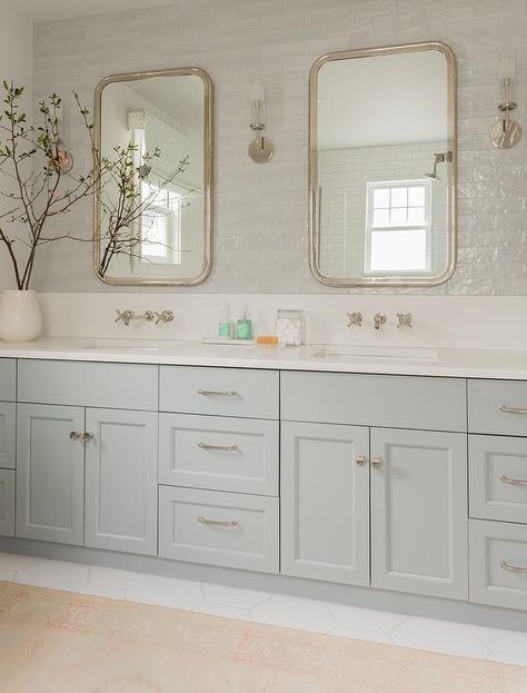 A light gray dual washstand adorned with satin nickel hardware is topped with a white quartz countertop holding sinks beneath satin nickel faucets fixed to a white quartz backsplash. Light Grey Backsplash, Light Grey Bathrooms, Grey Backsplash, Grey Bathroom Vanity, Transitional Bathroom, Master Bath Remodel, Upstairs Bathrooms, Bathroom Redo, Grey Bathrooms