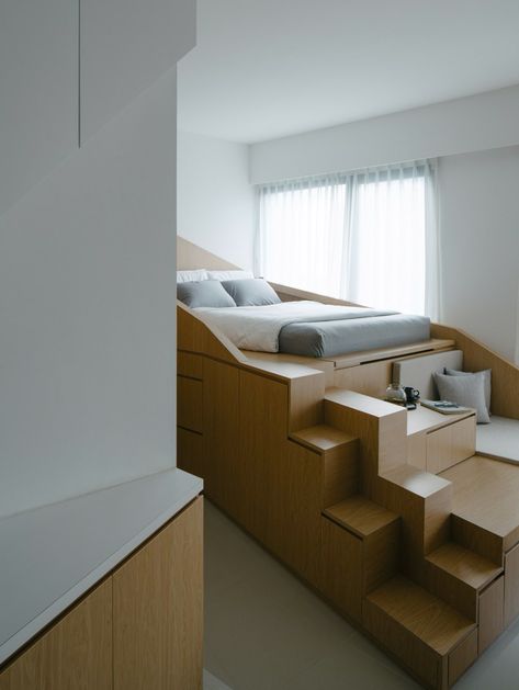 This adaptive furniture featuring a bed, seating and storage makes small spaces feel not so tiny - Yanko Design Small Kitchenette, Glass Partition Wall, Micro Apartment, Escalier Design, Small Apartment Interior, Loft Bedroom, Apartment Renovation, Wood Platform Bed, Apartment Interior