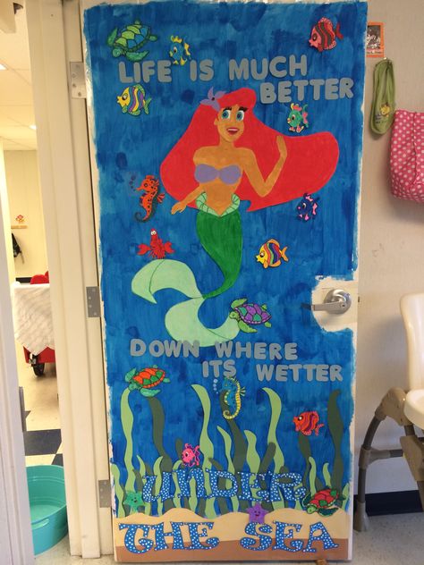 "The Little Mermaid" classroom door for an under the sea theme Mermaid Door Decorations, Little Mermaid Classroom Theme, Little Mermaid Bulletin Board, Mermaid Classroom Theme, Mermaid Classroom, Classroom Decor Middle, Ocean Classroom, Ocean Theme Classroom, Classroom Decor High School