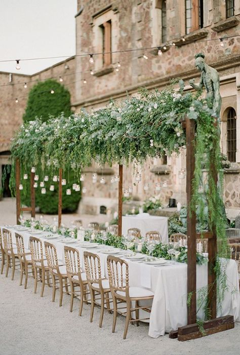 Amazing Hanging Greenery Installations for Your Wedding Courtyard French, Tuscan Wedding Theme, Wedding Reception Head Table, Reception Ceiling, Reception Head Table, French Courtyard, Greenery Wedding Centerpieces, Hanging Wedding Decorations, Greenery Wedding Decor