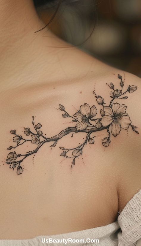 A black ink collarbone tattoo of a floral branch, featuring detailed line work and delicate flowers, creating a graceful and natural design. Small Collarbone Tattoo, Best Spine Tattoos, Collarbone Tattoo Ideas, Girl Spine Tattoos, Collarbone Tattoos, Simple Hand Tattoos, Hip Tattoo Small, Small Neck Tattoos, Spine Tattoo Ideas