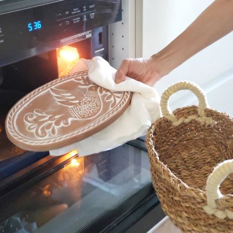 There’s nothing quite as comforting as warm bread. Keeping it warm as you're serving is the tricky part, but our Bread Warmer and Basket provides a simple, yet elegant solution. The terracotta bread warming stone is beautifully engraved with the dove with olive branch motif. The terracotta stone is naturally insulating, and the basket is handwoven from sustainably grown seagrass. Simply warm the bread stone in the oven and then add to the basket for serving. Idaho Farmhouse, Terracotta Plate, Basket Farmhouse, Bread Warmer, Dove With Olive Branch, Screen Print Tea Towels, Charcuterie Ideas, Cottage Vibes, Frugal Cooking