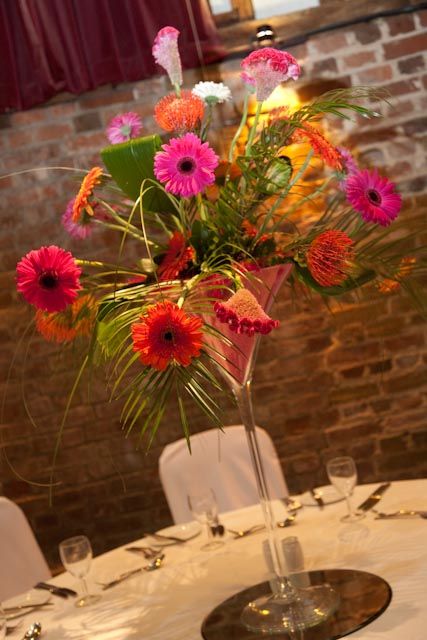 Bright and eyecatching martini vase centrepiece Vase Centrepiece, Madonna Inn, Bright Wedding Colors, Inn Wedding, Vase Centerpieces, Flower Centerpieces, Martini Glass, Colorful Flowers, Madonna