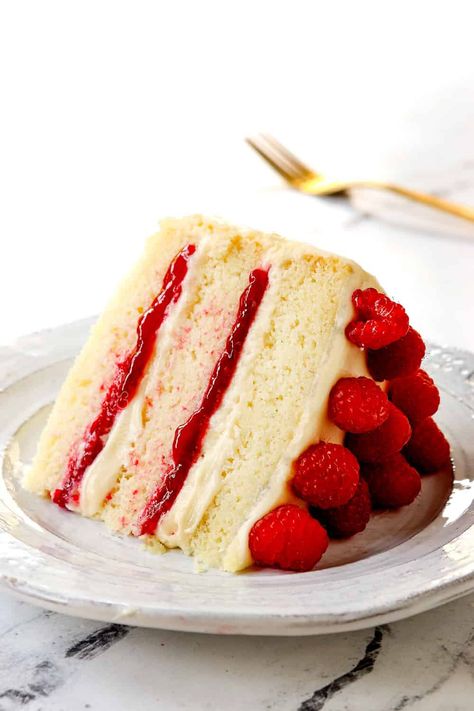 White Chocolate Raspberry Cake - Carlsbad Cravings Chocolate Cake With Raspberry Filling, White Chocolate Raspberry Cake, White Chocolate Cake, Carlsbad Cravings, Chocolate Raspberry Cake, Cake Layers, Raspberry Filling, Honey Buns, Raspberry Cake