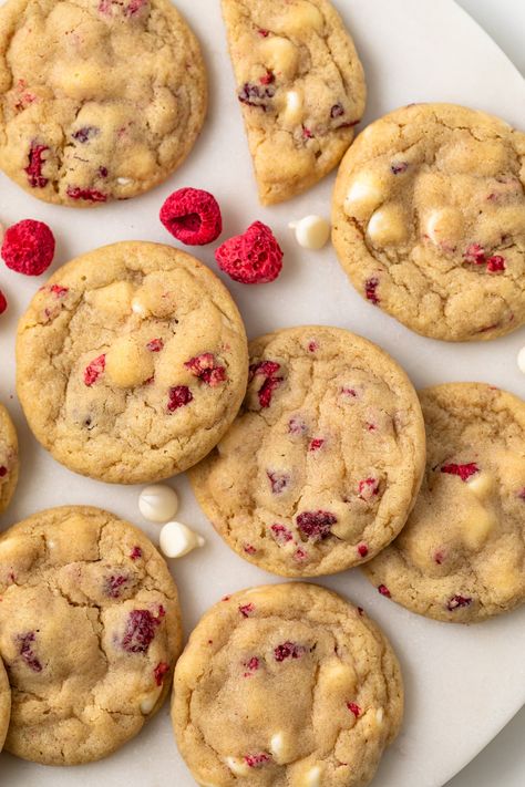 Flavorful and perfectly chewy, these White Chocolate Raspberry Cookies are perfect for weekend baking. They can be ready in 30 minutes with no chilling required! Cookies Raspberry White Chocolate, White Raspberry Cookies, Gooey Raspberry White Chocolate Cookies, Cookies With Raspberries, White Choc Raspberry Cookies, White Chocolate Chip Raspberry Cookies, White Chocolate And Raspberry Cookies, Raspberry Baked Goods, Raspberry White Chocolate Cookie