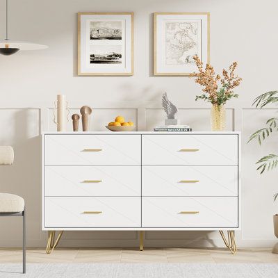 White dresser for bedroom. Features: - 6 Deep drawers: Ample space for daily storage - Anti-tipping device: Prevent your kids or pets from the incident - Gold handles: Create a clean and spacious look in your bedroom or living room - Wide tabletop: Offers a decent place for your daily stuff Specifications: - Color: White - Material: Engineered wood - Overall dimension: 47.2" L x 15.7" D x 29.5" H - Weight capacity: 35 lbs in each drawer Package includes: - 1 x 6 Drawer dresser - 1 x Instructions White And Gold Dresser And Nightstand, White And Gold Bedroom Dressers, Gold And White Bedroom, Dresser With Gold Handles, White And Gold Bedroom, White Girls Bedroom, Cute Dresser, White And Gold Dresser, Twins Bedroom