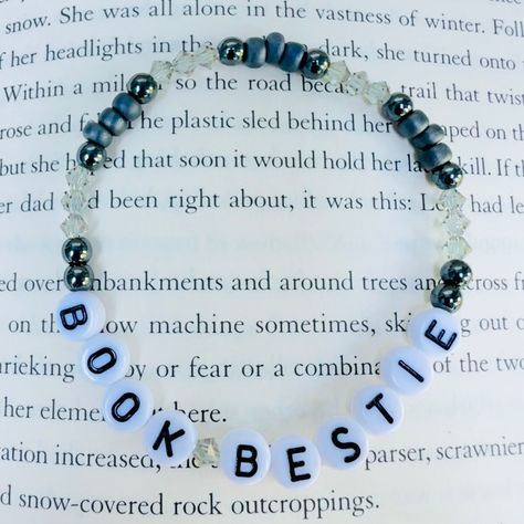 A beautiful, stretchy, easy-to-wear bracelet for book lovers . Crafted quality Japanese seed beads,  and pretty crystals, this stunning and stackable bracelet is the perfect gift a book lover, and your besties in your book club.  Handcrafted with love by a book loving English teacher. 📚 Book Bead Bracelet, Book Friendship Bracelet, Bookish Bracelet Ideas, Bracelet Ideas Letters, Bookish Friendship Bracelet, Letter Bracelet Ideas, Bookish Bracelet, Book Bracelets, Bracelet Letters