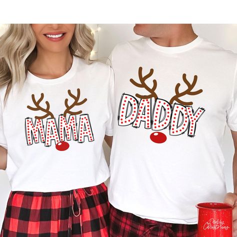 **Note your items will be printed on white or black t-shirt. Capture those picture-perfect Family Matching moments with our Christmas Family Shirts! These match family shirts are designed to make your Christmas Morning photos unforgettable. With a family shirt match like this, you'll have an adorable  look that's both fun and festive for your Christmas Season Family outtings. WHY YOU"LL LOVE IT: This classic unisex jersey short sleeve tee fits like a well-loved favorite, ensuring comfort and sty First Christmas Matching Shirts, Diy Family Christmas Shirts, Family Christmas Shirt Ideas, Matching Family Christmas Outfits, Christmas Matching Shirts, Cricket Designs, Family Christmas Outfits, Mommy And Daughter, New Mom Shirt