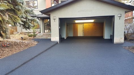 Don’t tear out your old concrete - repave with rubber — RenovationFind Blog Rubber Driveway Recycled Tires, Resurface Concrete Driveway, Concrete Resurfacing Driveways, Recycled Rubber Pavers, Repair Concrete Driveway, Rubber Driveway, Concrete Driveway Resurfacing, Rubber Pavers, Driveway Resurfacing