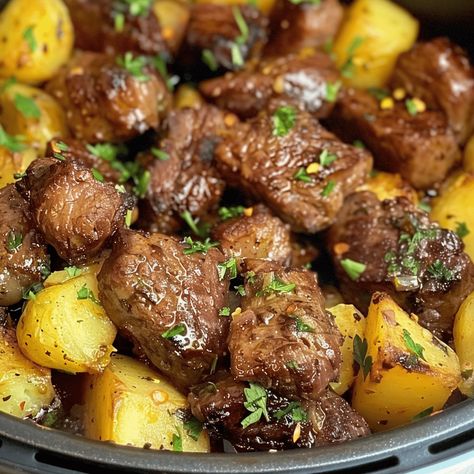 Transform your mealtime into a quick and savory delight with "Quick Feast: Air Fryer Garlic Butter Steak Bites and Potatoes." This recipe leverages the convenience and speed of an air fryer to create a succulent, Steak And Potato Air Fryer, Air Fryer Steak And Potato Bites, Garlic Butter Herb Steak Bites With Potatoes Instant Pot, Air Fryer Garlic Butter Steak Bites And Potatoes, Air Fryer Garlic Steak Bites And Potatoes, Steak Bites And Potatoes With Garlic Butter Air Fryer, Airfryer Steak And Potatoes, Steak And Potatoes In Air Fryer, Oven Steak And Potatoes