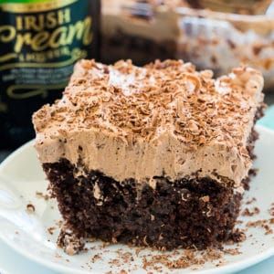 Irish Cream Poke Cake - Spicy Southern Kitchen Irish Cream Poke Cake, Desserts Potluck, Irish Cream Frosting, Irish Cream Cake, Cream Poke Cake, Spicy Southern Kitchen, Flavored Whipped Cream, Cake Mix Ingredients, Potluck Desserts