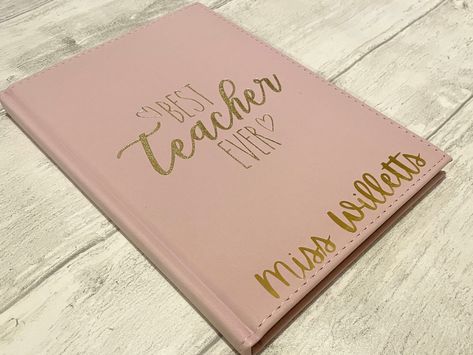 Best Teacher Ever Notepad / Notebook.  A5 hardback lined notepad with spiral binding.  Pink faux suede with embossed gold writing (best teacher ever).  Personalised with name in vinyl.  Choose which colour vinyl you would like.  Ideal for organisation and making notes. Lovely end of term teacher gift. Journal Designs, Teacher Notepad, Making Notes, Gold Writing, Vinyl Personalized, End Of Term, Vinyl Gifts, Best Teacher Ever, Spiral Binding