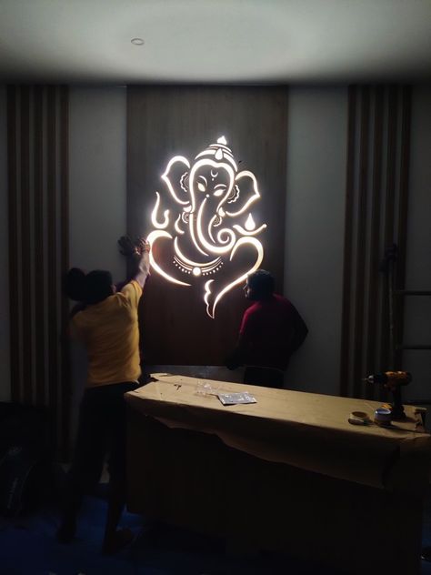 A beautiful display of God Ganesha to decorate hall. Cnc Frame Design, Ganesha Wall Decor, Ganesha Cnc Design, Ganesh Cnc Design, Pooja Units, Mandir Door, Temple Background, Mandir Ideas, Ganesh Design