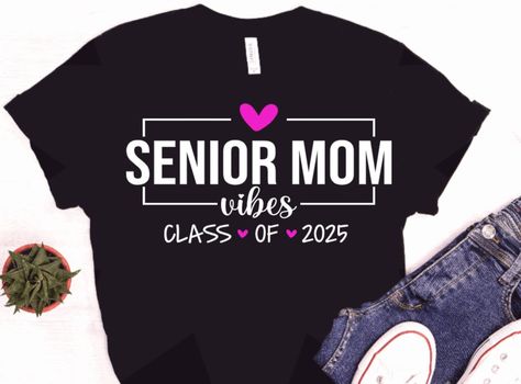 Senior mom 2025 shirt, Class of 2025, senior 2025 mom, proud mom 2025 senior, graduation, grad 2025 shirt, Senior year shirt design Additional images/shirts available here: https://www.etsy.com/shop/TXCraftyCouple Our shirts are made with high quality vinyl and pressed via a professional heat press. The printing process will allow you to wash and wear many times! These are unisex shirts- in my opinion they run like a normal t-shirt would run. For a looser fit, please order a size up. These shirts are super soft and comfy- you will find yourself wearing them every chance you can get!  Choose between a Bella + Canvas (soft feel) t-shirt OR Gildan 18000 Sweatshirt Senior Mom Shirt, Sr 25, Senior Games, Mom Vibes, Graduation Svg, Senior Shirts, Class Of 2025, Tea Shirt, Senior Graduation