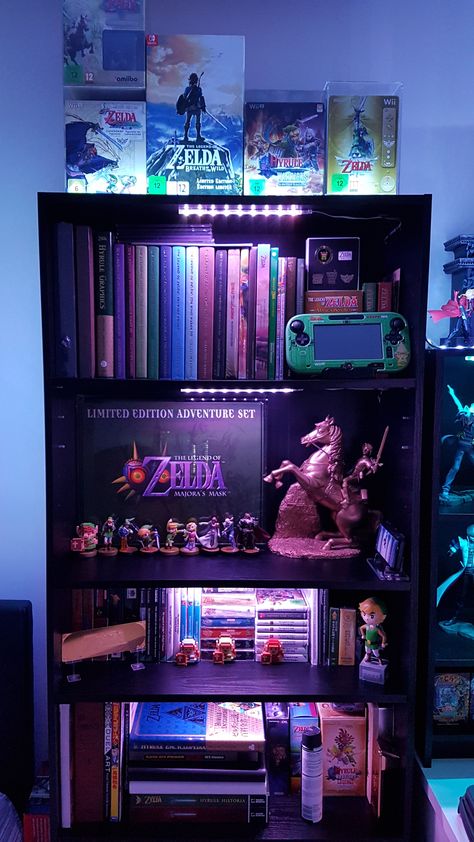 My Zelda Collection. Since everyone's posting them! Gamer Display Ideas, Zelda Collection Display, Legend Of Zelda Room Ideas, Zelda Boys Bedroom, Zelda Room Aesthetic, Video Game Collection Display, Gamer Bookshelf, Zelda Home Decor, Video Game Organization Ideas