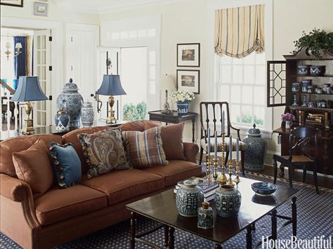 A Ralph Lauren Chilton Sofa is backed by a console that separates the living room and entry of a New Jersey house decorated by Scott Sanders. Brown Leather Sofa Living Room, Brown And Cream Living Room, Brown And Blue Living Room, Tan Living Room, Brown Sofa Living Room, Brown Living Room Decor, Leather Sofa Living Room, Dining Room Blue, Living Room Color Schemes