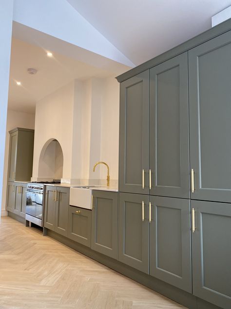 Green Shaker Kitchen. Gold knurled handles. Gold Quooker Tap. Silestone white worktop. Belfast sink. Arch. Kitchen With Gold Handles, Silestone Worktop, Quooker Tap, Green Shaker Kitchen, Painted Shaker Kitchen, Herringbone Flooring, Belfast Sink, Shaker Style Doors, Range Cooker