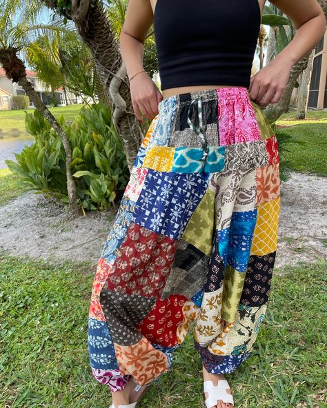 Beautiful lush hippie pants created with patchwork texture fabrics arranged geometrically in various hues are so much fun. The Harem pants enhanced with handmade designs, patch work and cuffed ankles, are a must have for beach festivals. #bohofashion #hippiepants #harempants #patchworkpants https://www.mogulinterior.com/collections/boho-pants Aladin Pants Outfits, Aladin Pants, Boho Hippie Pants, Cotton Yoga Pants, Genie Pants, Patchwork Pants, Cotton Harem Pants, Yoga Beach, Unisex Pants