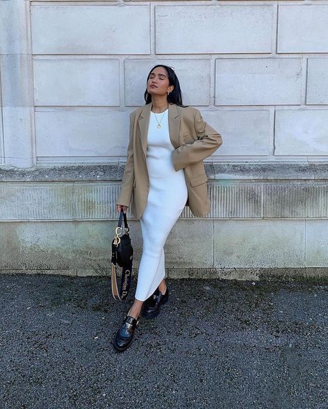 P R E T T Y L A V I S H on Instagram: “We love how @divrav has styled her cream Billie dress with a neutral oversized blazer, simple gold jewellery and black leather accessories…” White Dress And Blazer Outfit, Knit Dress And Blazer Outfit, Oversized Blazer With Dress Outfit, Midi Dress Blazer Outfit, Knitted Midi Dress Outfits, Cream Midi Dress Outfit, Blazer With Long Dress, Cream Knit Dress Outfit, Midi Dress And Blazer Outfit