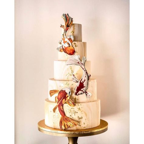 @cake_trends on Instagram: “Probably the grandest 80th Birthday cake. Handmade and hand-painted Koi fishes, marbling texture, 24k gold foil. 28” tall. Definitely…” Koi Fish Cake Design, Fish Cake Design, Koi Fish Cake, Koi Cake, Fish Wedding Cake, Fish Wedding, Creepy Costume, 80th Birthday Cake, Painting Cake