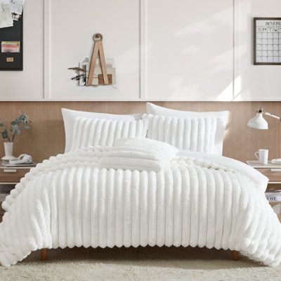 You won't be able to stop running your hands through this fabric! Our Everett comforter set is made with a luxurious faux fur fabric with an incredibly soft feel. The set is backed with our "micro mink" fabric that creates a reversible option to this set. The included 20x20 decorative pillow adds a great value to this set. | Mercer41 Hegg Channel Faux Fur White 4 PC Comforter Set White | Home Decor | C110802997_243013161_243013174 | Wayfair Canada Full Size Bed Comforter, White Comforter Bedroom, Comforter Bedding, Dorm Inspo, Bed Comforter Sets, White Comforter, White King, Comforter Bedding Sets, Preppy Room Decor