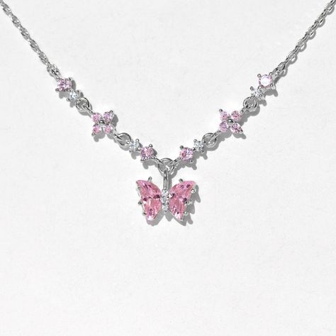 How adorable! The Flutter Love Necklace features an eye-catching baby pink butterfly in between a chain of enchanting CZ flowers. This piece radiates lustrous pink shimmers that are sure to amaze. You'll want to grab this one before it's too late! Flower Chain Necklace, Pink Quince Jewelry, Pink Butterfly Necklace, Pink Necklace Jewelry, Gold Chain Designs For Women, Girly Necklace, Pink Chain, Butterfly Chain, Mlp Oc