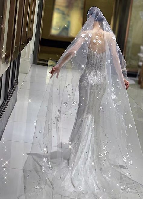 "Wedding Veil 2023 Color: white Fabric: tulle, flower Applicable scene: wedding  Length: 137\"  width 118\"                                                                                                                            The veil is made of tulle, I think you might like it. You'll look elegant in it. This veil is very sparkly and it will make you look even more dazzling on your wedding day. The wedding veils we make are the same as the pictures. Marriage is a very important thing, I think you must want to have a perfect wedding, hope to buy a perfect veil. You can consider choosing us, we will provide you with the best quality service. If you don't know how to choose the right color,  you can place an order to buy a color card, we have four colors for you to choose. We can custom Lace Veils Bridal, Sparkle Wedding Dress, 2023 Color, Wedding Veil Accessories, Sparkly Wedding, Bridal Veils, Sparkle Wedding, Pearl And Lace, Luxury Bridal