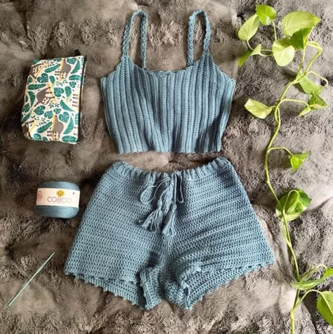 blue two piece crochet shorts and top by artfitbyzakyla. shown in flat lay format laid down on blanket. Crochet Set Pattern, Crochet Shorts Pattern, Crochet Two Piece, Crochet Flats, Crochet Blanket Designs, Crochet Swimwear, Crochet Mittens, Crochet Shorts, Crochet Fashion Patterns