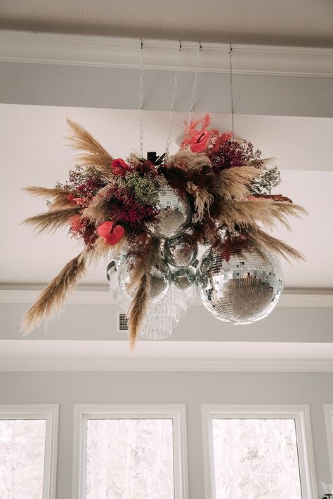 Disco Balls And Pampas, Disco Ball Pampas Wedding, Disco Ball And Pampas, Flower And Disco Ball, Pampas Grass And Disco Balls, Pampas Disco Ball, Disco Ball Ceiling Installation, New Years Eve Flowers, Disco Ball Florals