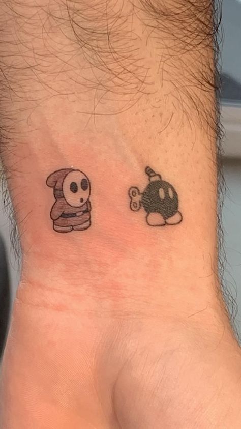 Shy Guy Mario Tattoo, Shy Guy Tattoo Design, Easy Outline Tattoo Ideas, Mario Matching Tattoos, Bob Omb Tattoo, Shy Guy Drawing, Black Guy Tattoos, Shy Guy Tattoo, Car Guy Tattoos