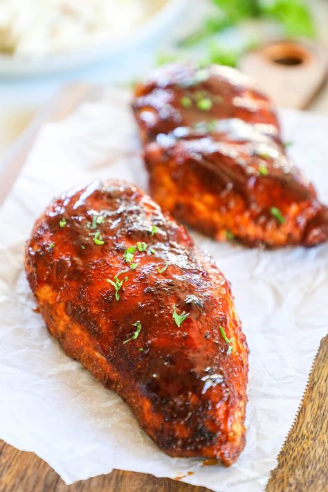 This 30 Minute Baked BBQ Chicken Breast is a summer recipe you can enjoy all year long! The chicken is slathered in a sweet, smoky, savory spice blend, covered in BBQ sauce, then baked until tender and juicy. Serve this Oven-Baked BBQ Chicken with any of your favorite summer side dishes. It's a meal that the whole family will love that takes just 5 minutes to prep. Serve this BBQ Oven Baked Chicken as is or shred it up and use it in another recipe! Oven Bbq Chicken Breast, Baked Bbq Chicken Breast, Bbq Baked Chicken Breast, Baked Bbq Chicken Recipes, Bbq Chicken Breast Recipe, Oven Bbq Chicken, Oven Baked Bbq Chicken, Easy Bbq Sauce, Easy Bbq Recipes