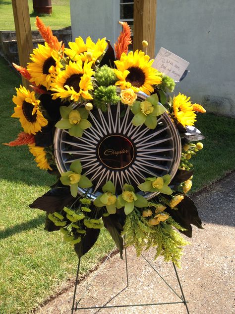 Hubcap flower arrangement from the grandchildren for Memorial Service. Pop Pop sold hubcaps and wheels. Done by Flowers by Audrey, Reading, PA Car Wreath, Graveside Decorations, Diy Angels, Memorial Flowers, Reading Pa, Pop Pop, Flower Arrangements Diy, Father's Day Diy, Floral Ideas