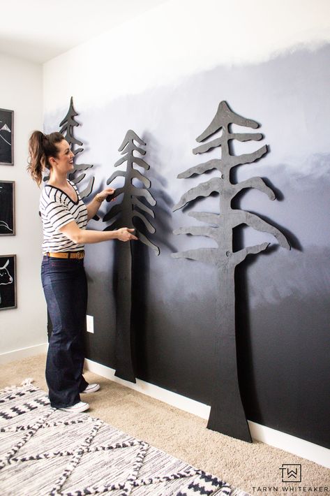 Learn how to easily create your own DIY Forest Accent Wall that will make a huge impact in your space! Cut these trees out of plywood using a jigsaw and give them a coat of paint! Full tutorial on the blog. Wood Trim Accent Wall Mountains, Forest Accent Wall, Tree Accent Wall, Diy Forest, Modern Boys Rooms, Adventure Room, Camp Decor, Gallery Wall Staircase, Ombre Wall