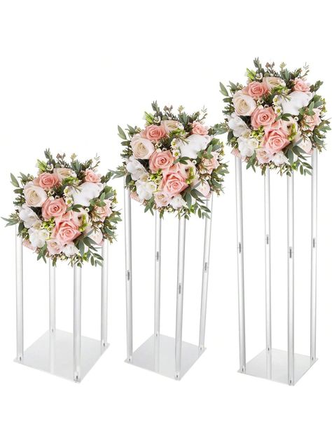 Product Description  Description A successful wedding ceremony cannot be without beautiful flowers. This wedding flower stand set uses high-quality acrylic and has a stable structure, allowing your flowers to be placed steadily and neatly. Its simple structure and smooth surface allow for easy installation and cleaning. You can place it indoors or outdoors. You can use various items to decorate it, and having it will make your wedding even more romantic.  Specification Material: Acrylic Style: Modern Color: Clear Shape: Rectangle Process: Lathe Drilling Process Assembly Required: Yes Mount Type: Free Standing Number of Items: 3 Each Stand Max. Load-bearing Capacity: About 3kg/6.61 lbs Product Size: 20*20*40cm/7.87*7.87*15.75in, 20*20*60cm/7.87*7.87*23.62in, 20*20*80cm/7.87*7.87*31.5in Each Tall Flower Vase, Wedding Table Decorations Centerpieces, Geometric Centerpiece, Decorative Columns, Acrylic Vase, Clear Vases, Wedding Party Table, Tall Flowers, Flower Stand