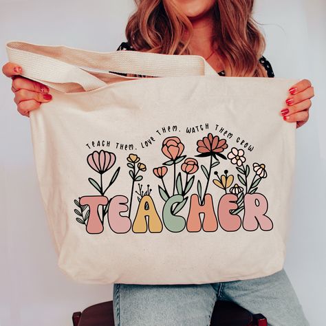 Teacher Tote Bag, Teacher Bag, Personalized Teacher Gift, Custom Tote Bag, Christmas Gift for Teacher Appreciation SHOP TEACHER GIFTS HERE: https://etsy.me/3M5a8Vj * 20"W x 15"H x 5"D * 100% heavy cotton canvas * Large main compartment with zippered closure * Inside zippered flap pouch pocket Shop with Confidence! We are a 5-Star Rated Shop operating since 2015! SHIPPING: We have the fastest handmade Production time! Most items ship within 1-3 days (see each listing's "Estimated arrival" section Teachers Day Gift Ideas Products, Teacher Bags Tote, Teacher Tote Bag Ideas, First Day Of School Teacher Gifts, Teacher Canvas Bag, Free Teacher Appreciation Gifts, Customized Tote Bags, Teacher Tote Bag Gift, Handmade Teacher Gifts