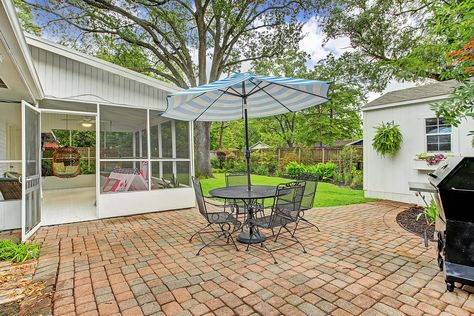 Look Inside: A Blue Beauty (with a Screened-In Porch) in Houston for $420K: gallery image 44 Back Porches, Brick Walkway, Shady Tree, Herringbone Backsplash, Lush Lawn, Big Backyard, Modern Appliances, Blue Beauty, Green Door