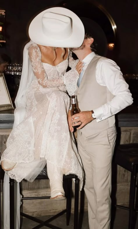 Wedding Dresses With Cowboy Hat, White Boots With Wedding Dress, Wedding Dress With Cowboy Hat, Wedding Dress Cowboy Hat, Bride And Groom Cowboy Hats, Wedding Cowboy Hat Bride, Cowboy Hat Wedding Pictures, Cowboy Hat Wedding Grooms, Wedding Cowboy Hat