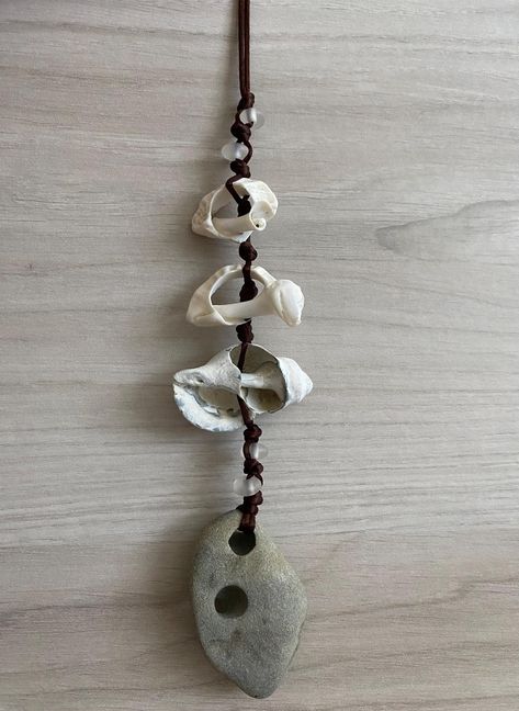 Hag stones are said to have many uses. Protection, Meditation, Astral Travel, Cleansing Rituals, Divination, Connection with the spiritual realm or with ancestors who have passed on, just to name a few.   Hag Stone with Shells and Sea Glass/Recycled Glass Wall Hanging, Holey Stone Wall Hanging, Odin Stone Wall Art, Protection Stone Hag Stone Wall Hanging with shells and sea glass/recycled glass. Hag stone found on Bullard's Beach in Bandon Oregon and the shells were found on Revere Beach in Reve Things To Do With Sea Shells, Revere Massachusetts, Protection Meditation, Holey Stone, Revere Beach, Cleansing Rituals, Bandon Oregon, Glass Wall Hanging, Stone Wall Art