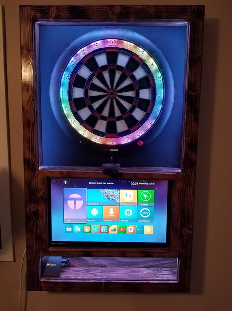 Custom made dartboards for your home. Granboard 3 with a TV included! Electronic Dart Board Cabinet, Dart Board Games, Custom Dart Board, Electronic Dart Board, Dart Board Cabinet, Game Room Man Cave, Dart Boards, Pool Tables, Sound Dampening