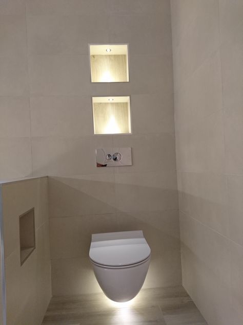 Lighting in recesses and under toilet Bathroom Nib Wall Toilet, White Beige Bathroom, Sanctuary Bathroom, Small Toilet Design, Recess Lighting, Moon Globe, Borrowed Light, Hidden Lighting, Lights At Night