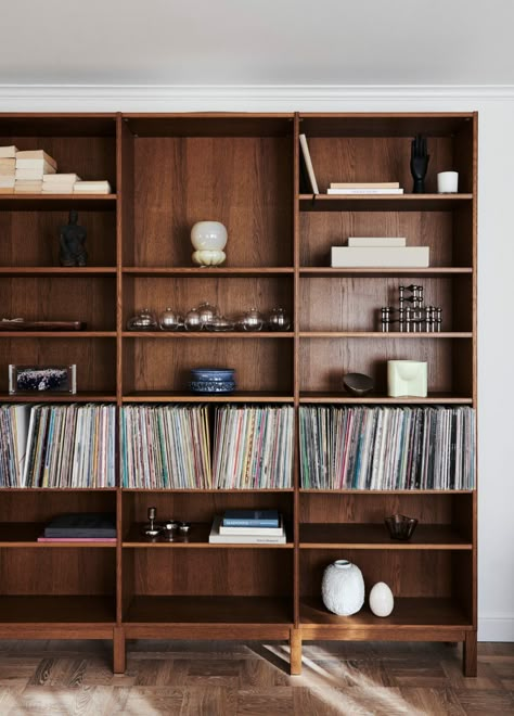 Mid Tone Wall Colors, Wooden Bookshelves In Living Room, Mcm Built In Bookcase, Hallway Bookcase Ideas, Dark Wood Built Ins, Wabi Sabi Bookshelf, Wood Built Ins Living Room, Whole Wall Bookshelves, Record Bookshelf