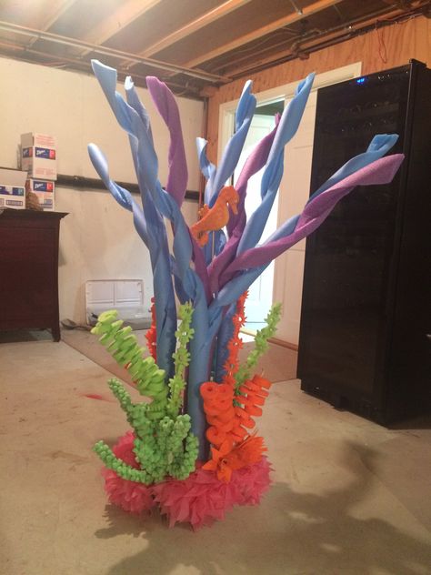 This is a coral reef made for the The Little Mermaid Jr. The bulk of it is from pool noodles, foam flowers, and the lower flowers are from plastic table cloths. @rainbow18 Submerged Vbs, Decor Marin, Under The Sea Decorations, Mermaid Bathroom, Vbs 2024, Mermaid Parties, Sea Decor, Little Mermaid Birthday, Pool Noodle