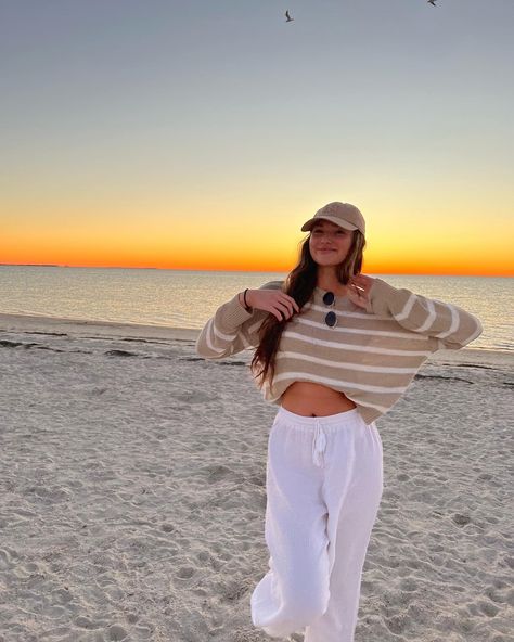 beach outfit, tan striped sweater, white beach pants Cute Beach Outfits Cold Weather, Sunset Outfits Beach Comfy, Legging Beach Outfit, Comfy Beach Outfit Winter, Covered Beach Outfit, 60 Degree Beach Outfit, Winter Outfits For Beach, Comfy Beach Outfit Cold, Cute Beach Winter Outfits