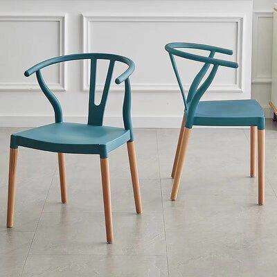 These chairs are versatile and practical pieces that you can quickly incorporate into your interior. Create the look you’ve always wanted with their easy-to-match design and colors. Featuring an elegant Y-shaped design, this dining chair set will look and feel at home in both traditional and modern spaces. In fact, its smooth, minimalist silhouette can be a refreshing alternative to heavier-looking dining chairs. These mid-century modern chairs may be anomalies in their own right. That’s because Blue Outdoor Dining Chairs, Funky Dining Chairs, Colourful Dining Chairs, Colorful Dining Room Chairs, Colorful Dining Chairs, Blue Dining Chairs, Teal Dining Chairs, Cali House, Colored Dining Chairs