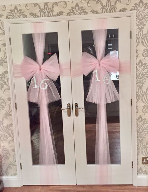 Baby pink door bows created for 16th birthday. Pink netting used to create the bows Unique Party Ideas Creative, Bow Decorations For Birthday, Simple Pink Party Decorations, Pink Gold White Sweet 16 Decorations, Pretty In Pink Decorations, 18th Pink Birthday Party Ideas, Pink Birthday Party Inspiration, Sweet 16 Pink Decor, Pink And Bows Birthday