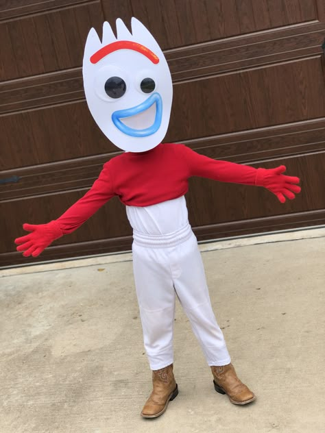 Make your own Forky costume from Toy Story 4 by wearing white pants, white undershirt, red long sleeve shirt folded and pinned up and red gloves! Pair these up with a Forky mask from Party City for $12 and a rainbow sticker to complete the costume #forky #forkycostume #toystory4 #toystory  #halloweencostumes #diy #diycostumes #diyhalloweencostume Toy Story Spork Costume, Sporky Toy Story Costume, Rex From Toy Story Costume Diy, Cardboard Diy Costume, Forky Halloween Costume, Tv Commercial Costumes, Toy Story Family Costumes Diy, Diy Forky Costume, Forky Costume Diy