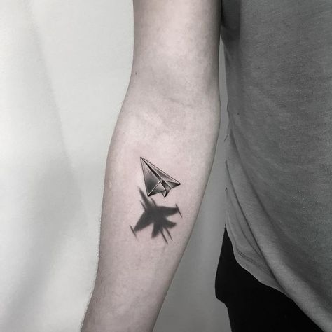 Pin em tattoo Jet Tattoo, Muertos Tattoo, Paper Airplane Tattoos, Paper Plane Tattoo, Engine Tattoo, Wrist Band Tattoo, Tattoo Leggings, Plane Tattoo, Shadow Tattoo